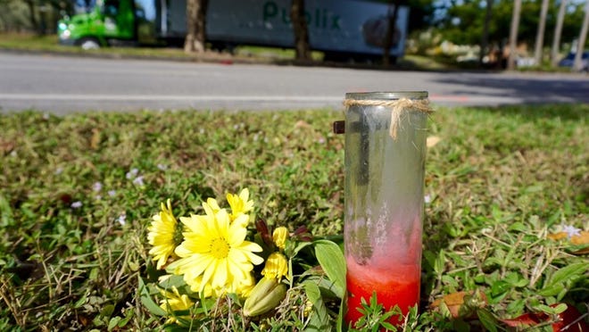 Flowers and a candle mark the scene of a hit and run Monday that took place Saturday night in Boynton Beach. The accident claimed the life of Khiar Raymond, 15, as he walked along the 2000 block of High Ridge Road with his brother and a friend on their way home after attending an event at Boynton Beach High School. Police are looking for a woman and her red or maroon Mercedes sedan.