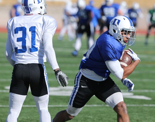 Duke running back Shaquille Powell, right, runs past cornerback Breon Borders during practice earlier this week ahead of today's matchup with Arizona State in the Sun Bowl.