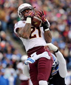 Arizona State's Jaelen Strong, top, makes a catch on a long pass against 
Duke during the first quarter of the Sun Bowl Saturday in El Paso, Texas.
ASSOCIATED PRESS / VICTOR CALZADA