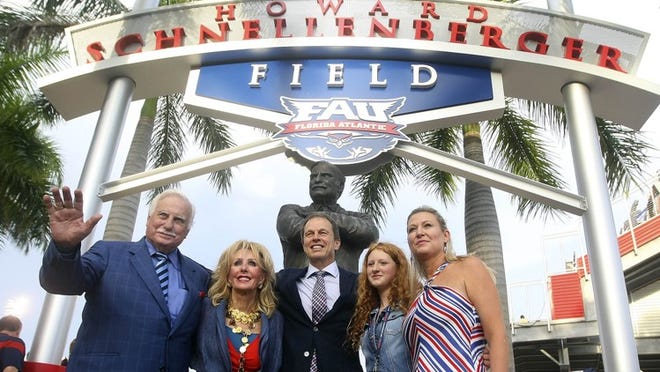 FAU President John Kelly (third from left), predicts that raising the football team’s field game will result in more competitive student applications, and more generous alumni donations. (Bill Ingram / Palm Beach Post)
