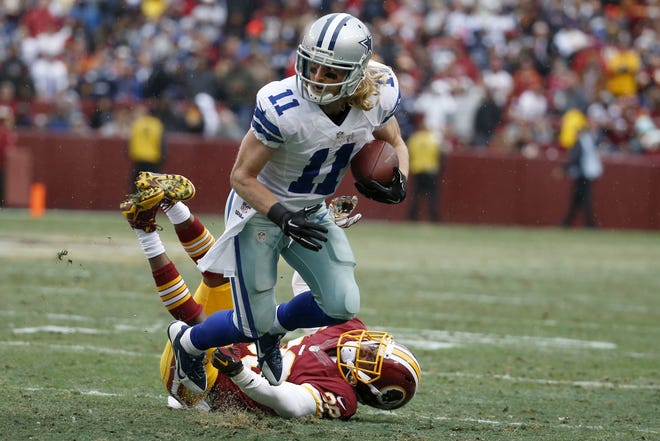 Dallas Cowboys wide receiver Cole Beasley (11) breaks a tackle by Washington Redskins cornerback Justin Rogers during the second half Sunday in Landover, Md. The Cowboys won, 44-17. (AP Photo/Alex Brandon)