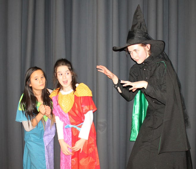 From left, Jenna Jennison, Mia Larson and Abigail Wren, all of Sutton, as the Munchkins and the Wicked Witch in Apple Tree Arts' production of "The Wizard of Oz."