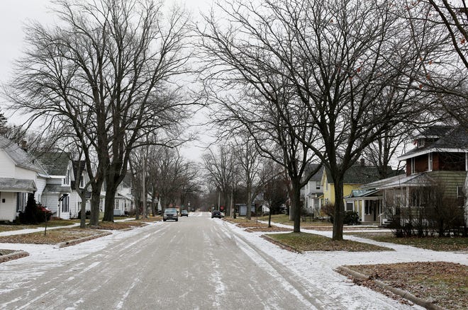 There was little to no snow on 15th Street on Tuesday, Dec. 30, 2014, in Holland. Emily Brouwer/Holland Sentinel