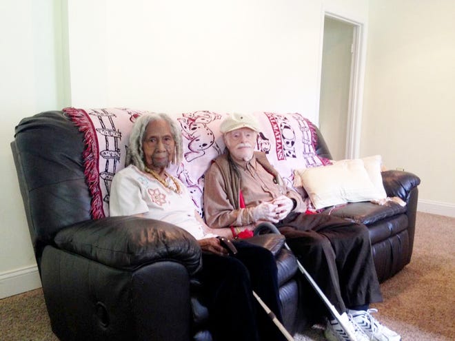 Edith Hill, 96, and Eddie Harrison, 95, sit together in their home in Annandale, Va. Harrison died Tuesday, weeks after his wife was taken away by family members to Florida. Rebecca Wright, who was caring for the couple in their home said Harrison was distressed after his wife was taken away.