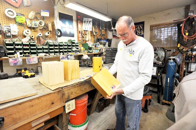 RETIRED AIR FORCE MASTER SGT. MIKE DELPIZZO constructs wooden urns in his garage workshop and donates them to the Jacksonville National Cemetery to hold the remains of veterans.