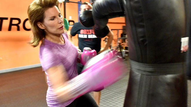 Former Ambassador Nancy Brinker goes through her workout Tuesday at BoxFit in West Palm Beach. I want to look upright and healthy. And also, I think it’s helped me just with my overall energy level,’ she said.