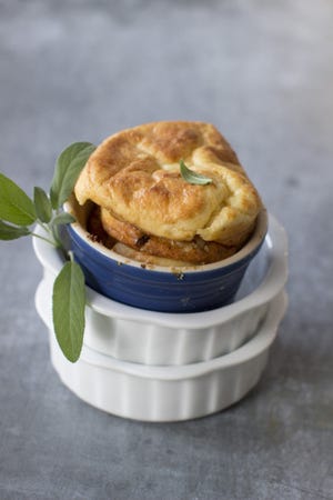 Bring a touch of elegance to your table with these Cheddar and Walnut Souffles on Arugula with Pear Dressing.