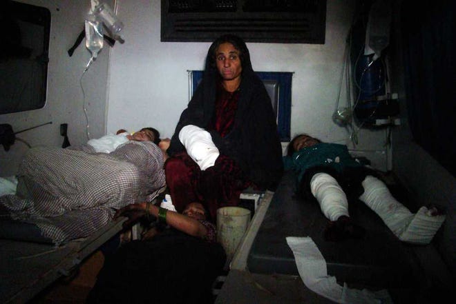 Afghan injured children are treated at hospital in Helmand province, south of Kabul, Afghanistan, Wednesday, Dec. 31, 2014. A rocket fired amid fighting between Taliban insurgents and Afghan soldiers killed at least 26 people at a nearby wedding party Thursday night, authorities said, a grim end to a year that saw the end of the 13-year U.S.-led combat mission there. (AP Photo/Abdul Khaliq)
