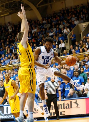 Duke's Justise Winslow, right, is one of three Duke freshmen who the Blue Devils wants to continue developing.