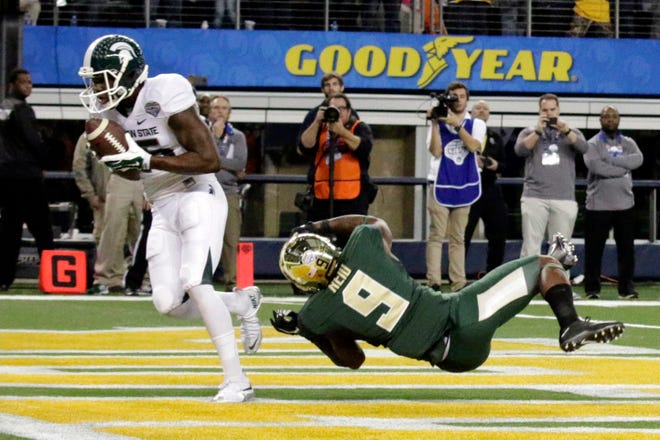 Michigan State wide receiver Keith Mumphery caught the game-winning, 10-yard touchdown pass from Connor Cook with 17 seconds left to lead the Spartans to a 42-41 win over Baylor. (AP Photo/LM Otero)
