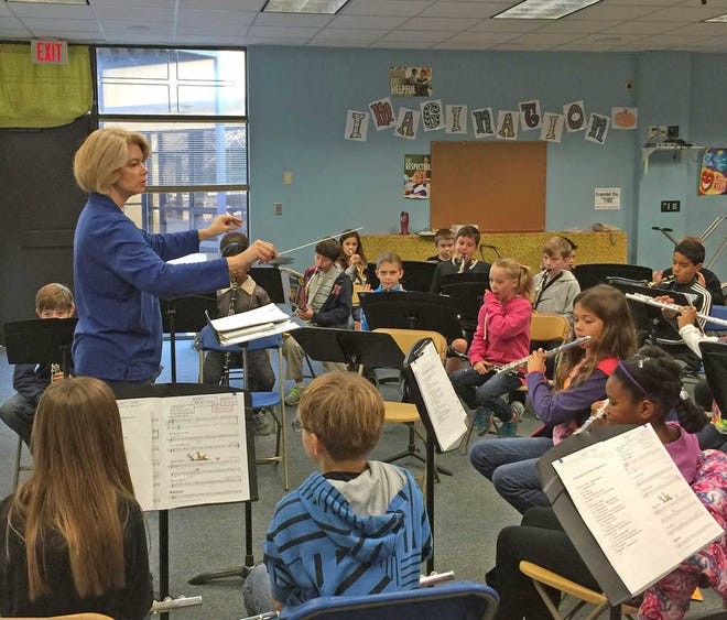 Mrs. Kathe Isabelle, director of the Julington Creek Elementary School's Jammin' Jaguar Band, puts the band through a practice session.