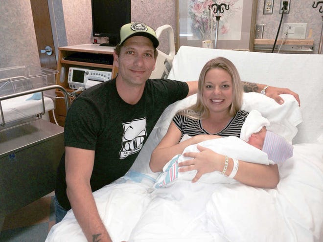 Jonas Stephens, left, and Tiffany Stephens hang out with Mason Riggs Stephens on Thursday at Memorial University Medical Center. Born at 12:12 a.m., Mason is Savannah's first baby of 2015. (photo courtesy of Laura Gray/Memorial)