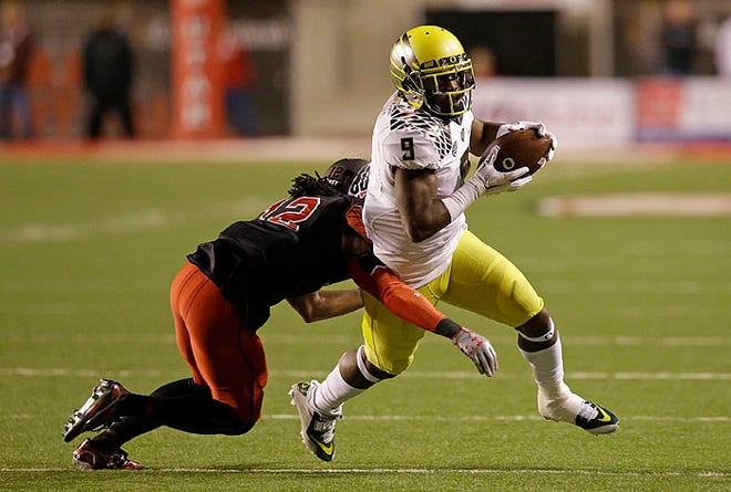 Byron Marshall, right, led Oregon in rushing last season, and, after switching from running back, is the Ducks' leading receiver this season.