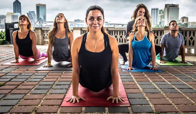 Ron Whittington for The Times-Union A former Navy helicopter pilot, Kathryn Thomas overcame a debilitating ankle break with yoga, and now works with the Jacksonville Sheriffs Office and other organizations to share the benefits of the practice.