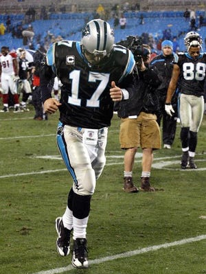 (Photo by John Clark) Carolina Panthers quarterback Jake Delhomme runs off the field following a 33-13 playoff loss in the 2008 NFC Divisional playoffs at Bank of America Stadium in Charlotte.