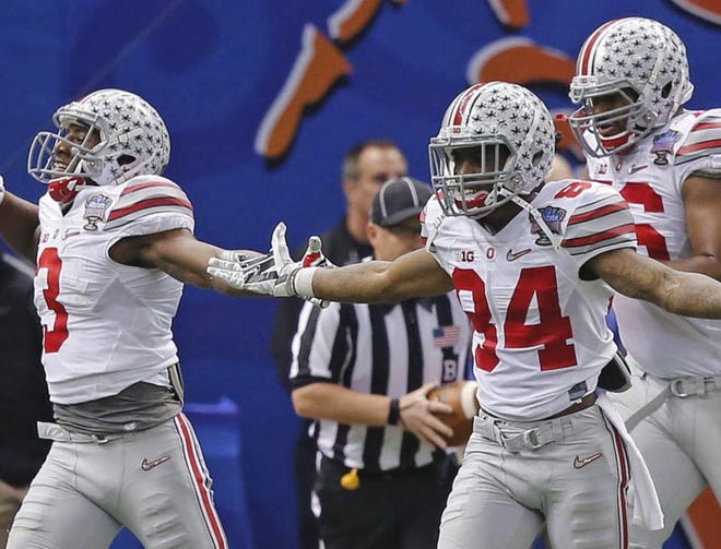 Ohio State players celebrate a touchdown by running back Ezekiel Elliott in the second half of the Sugar Bowl NCAA college football playoff semifinal game against Alabama on Thursday night in New Orleans.