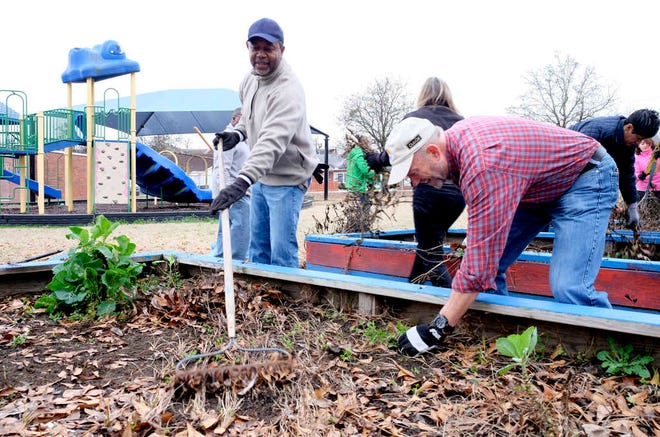 Augusta Mayor-elect Hardie Davis (left) and Ed Enoch clear garden plots at the Boys and Girls Club of the CSRA.
