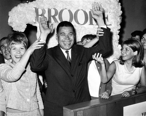 This Sept. 14, 1966, file photo shows Edward W. Brooke joining campaign workers in celebration, in Boston, after winning the Republican nomination for U.S. Senate. Brooke, the first black to win popular election to the Senate, has died. He was 95. Ralph Neas, a former aide, said Brooke died Saturday, Jan. 3, 2015, of natural causes at his Coral Gables, Fla, home.