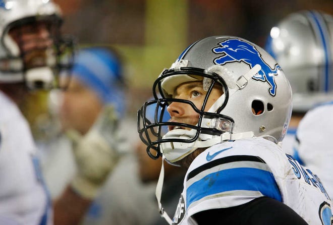 Detroit Lions' Matthew Stafford watches from the bench during the second half of an NFL football game against the Green Bay Packers Sunday, Dec. 28, 2014, in Green Bay, Wis. The Packers won 30-20. (AP Photo/Matt Ludtke)