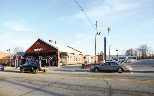 Herald file photo — Newton has unveiled a plan to redevelop the area that includes the former McGuire Chevrolet dealership, the post office and adjacent properties.