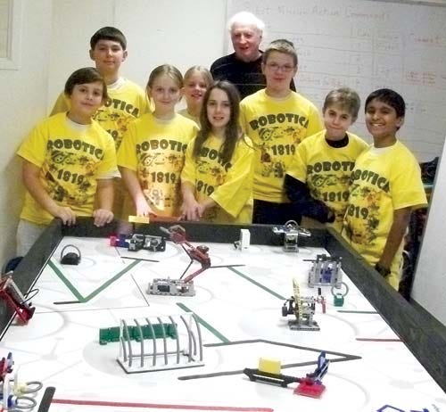 Photo by Patricia Sullivan — The St. Joseph’s Regional School robotics team is seen with coach Frank Sullivan.