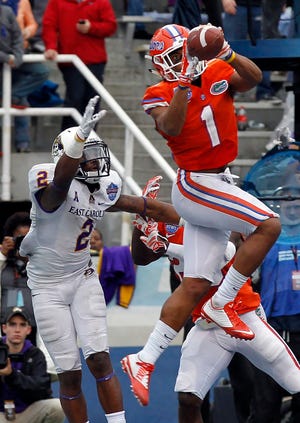 Florida defensive back Vernon Hargreaves (1) intercepts a pass in the end zone intended for East Carolina wide receiver Justin Hardy (2) to secure the Gators' 28-20 win late in the fourth quarter of the Birmingham Bowl on Saturday. (AP Photo/Butch Dill)