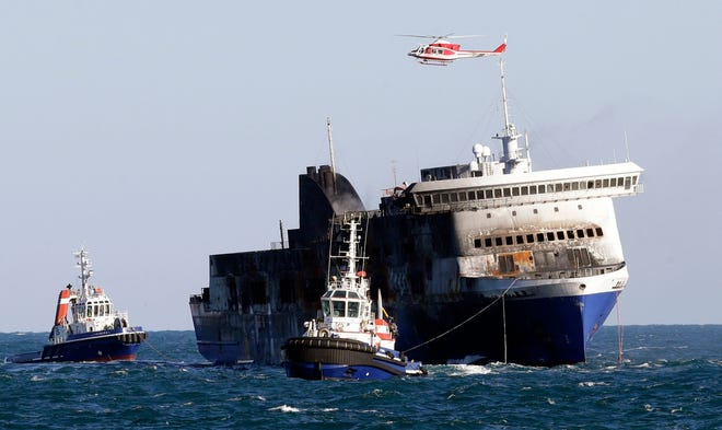 The Norman Atlantic ferry is towed Friday into the port of Brindisi, Italy, 
after a blaze broke out Sunday as the ship was traveling from Greece.AP 
PHOTO / ANTONIO CALANNI