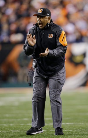 Cincinnati coach Marvin Lewis will try to earn his first playoff win today when the Bengals play at Indianapolis in an AFC Wild Card game. THE ASSOCIATED PRESS