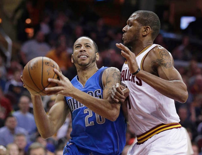Dallas' Devin Harris (left) drives past Cleveland's James Jones during the third quarter. Harris had eight points as the Mavs handed the Cavs their fifth loss in seven games.