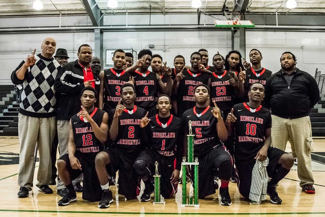 Scott Schroeder/For Bluffton Today The Ridgeland-Hardeeville boys basketball team poses with its championship trophy after winning the Bobcat Classic on Tuesday.