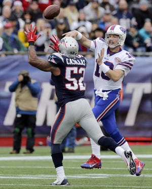 Patriots linebacker Jonathan Casillas (52) moves in to pressure Buffalo Bills quarterback Kyle Orton in the regular-season finale last Sunday at Gillette Stadium. Casillas, who was acquired from Tampa Bay in midseason, also plays for the Patriots on special teams. CHARLES KRUPA/ASSOCIATED PRESS