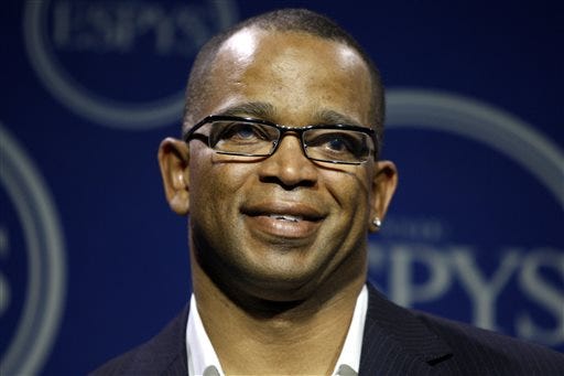 In a Wednesday, July 16, 2008 file photo, Stuart Scott poses in the press room at the ESPYs Awards,in Los Angeles. Scott, the longtime “SportsCenter” anchor and ESPN personality known for his known for his enthusiasm and ubiquity, died Sunday, Jan. 4, 2015 after a long fight with cancer. He was 49. (AP Photo/Matt Sayles, File)