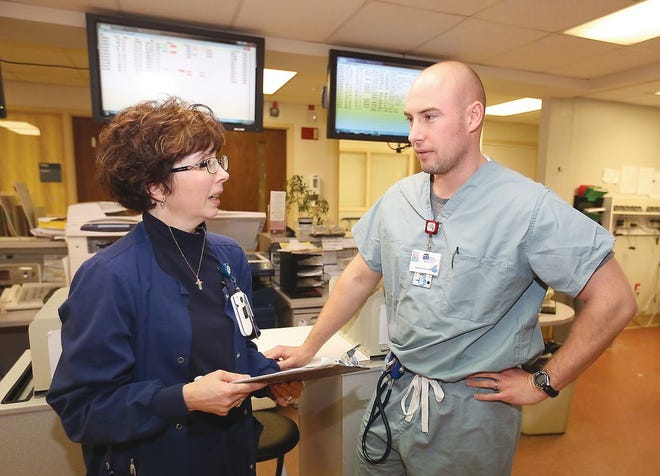Rebecca Craig, Union Hospital Emergency Department manager, and Dr. Randy Allison Emergency Department Physician prepare for the busy day in the emergency department Monday.