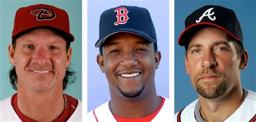 From left are Arizona Diamondbacks' Randy Johnson in 2008, Boston Red Sox' Pedro Martinez in 2003 and Atlanta Braves' John Smoltz in 2008. Randy Johnson, Pedro Martinez and John Smoltz are the leading newcomers on baseball's Hall of Fame ballot when voting is announced Tuesday, Jan. 6, 2014. (AP Photo/File)