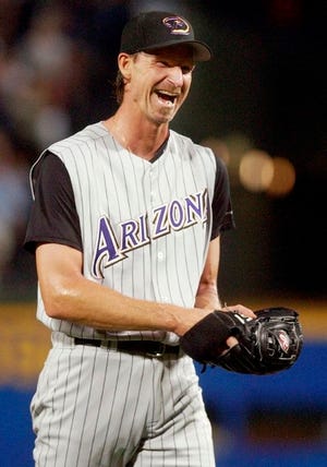 In this May 18, 2004, file photo, Arizona Diamondbacks starter Randy Johnson reacts after pitching a perfect game against the Atlanta Braves in Atlanta. Johnson was elected to the National Baseball Hall of Fame Tuesday, Jan. 6, 2015.