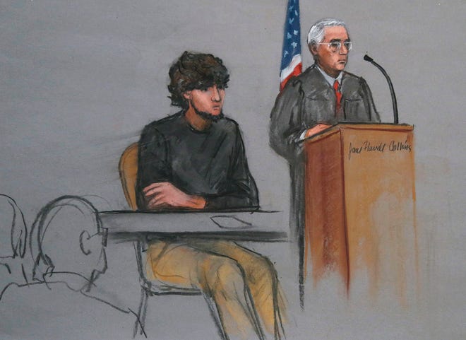 In this courtroom sketch, Boston Marathon bombing suspect Dzhokhar Tsarnaev, left, is depicted beside U.S. District Judge George O'Toole Jr. as O'Toole addresses a pool of potential jurors in a jury assembly room at the federal courthouse on Monday, Jan. 5, 2015, in Boston. Tsarnaev is charged with the April 2013 attack that killed three people and injured more than 260. His trial is scheduled to begin on Jan. 26, 2015. He could face the death penalty if convicted.