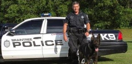 Braintree police officer Thomas Flannery with his partner, a German shepherd named Car. The dog, which had worked with Flannery for 9½ years, died on Saturday, Jan. 3, 2015.