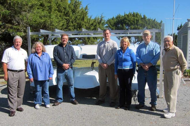 SAPA Extrusions, a St. Augustine branch of the worldwide SAPA Group, recently built and presented a boat rack to the St. Augustine Yacht Club (SAYC) for its Junior Sailing Program. This past summer, 180 juniors were introduced to the art of sailing, in many cases because of grants and scholarships provided by organizations. Pictured from left: David Patrick, Nicole Stewart, Tom Zak, Matt Mitchell, Judy Fegen, Richard Haight and Tony Palazzo.