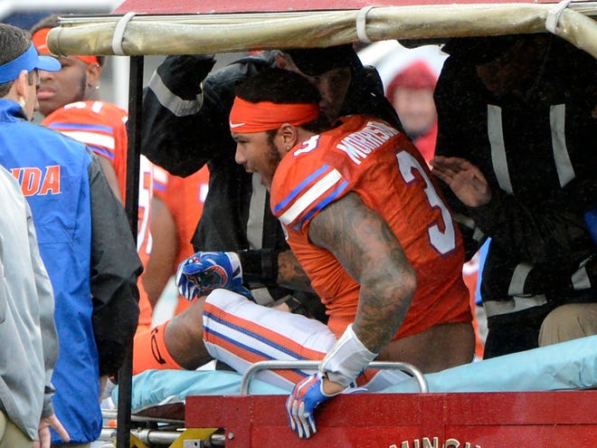 Florida linebacker Antonio Morrison sits on a medical cart after being injured in the second quarter of the Birmingham Bowl against East Carolina at Legion Field in Birmingham, Ala., on Saturday. (AP Photo/ AL.com, Mark Almond)