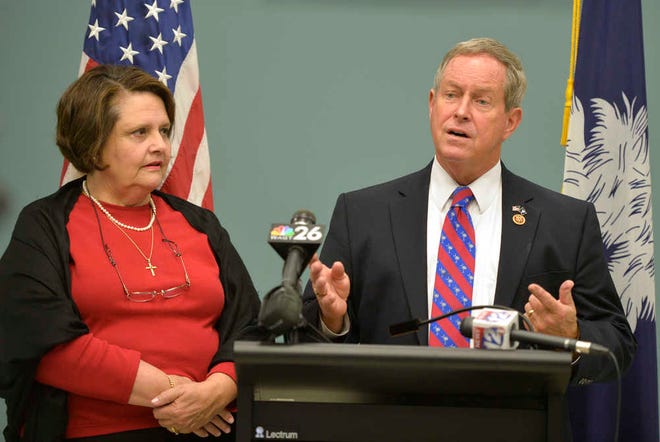 Accompanied by his wife, Roxanne Wilson, U.S. Rep. Joe Wilson of South Carolina holds a press conference in Aiken to highlight his legislative agenda for the upcoming year.