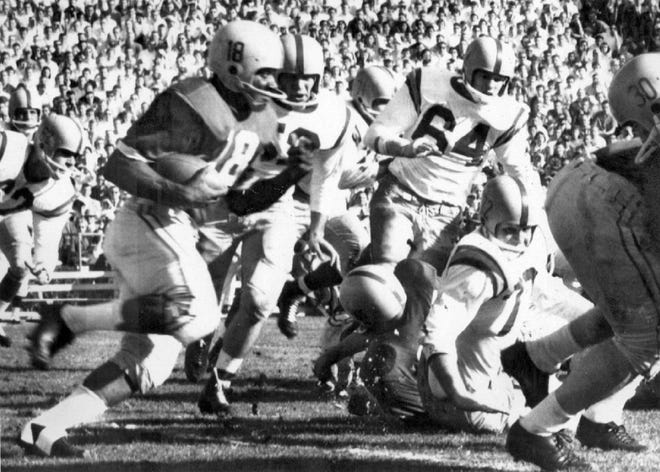 Ohio State running back Don Clark gains 27 yards in the first quarter against Oregon in the 1958 Rose Bowl.
