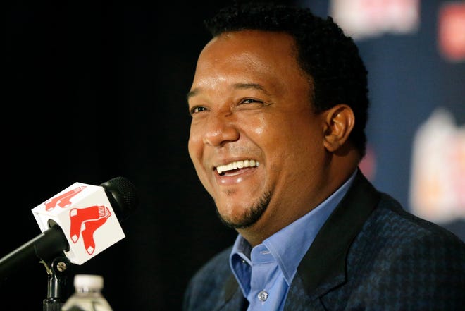 Former Boston Red Sox pitcher Pedro Martinez speaks Tuesday at Fenway Park, in Boston, after being elected to baseball’s Hall of Fame. Martinez, a three-time Cy Young winner, helped the Red Sox to their first World Series title in 86 years in 2004.