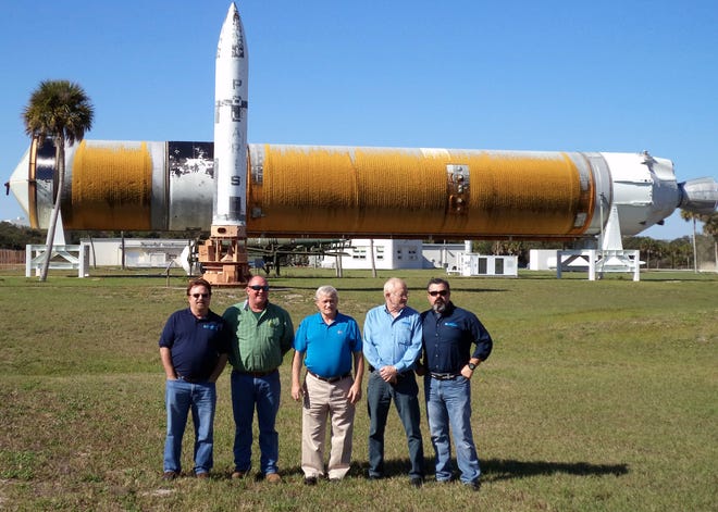 iNFADS Team - Naval Facilities Engineering Command (NAVFAC) Southeast Asset Management iNFADS (internet Navy Facilities Asset Data Store) Asset Evaluation Team comprised of (from left) Roy Matthews, Roger Wiley, Barry Matthews (Team Lead) Tom Benton and Jose Torres are in front of an old booster rocket near Port Canaveral, Fla., during their trip in December. The team visited several locations in Florida during the month of December to validate property records of Navy owned real estate, facilities, and utilities in the Southeast region.