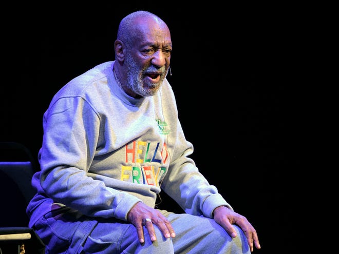 Bill Cosby performs during a show on Nov. 21, 2014, at the Maxwell C. King Center for the Performing Arts in Melbourne, Fla. The scandal-plagued comedian returns to the stage Wednesday, Jan. 7 for the first time since November with some planning protests, others vowing not to show up and others still saying they will heckle the comedian in Canada.