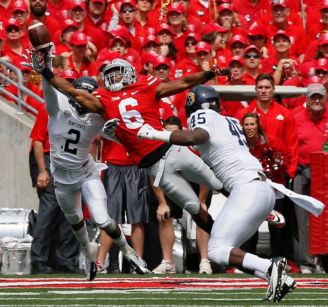 As the son of Tim Spencer, receiver Evan Spencer (6) grew up immersed in the Buckeyes.