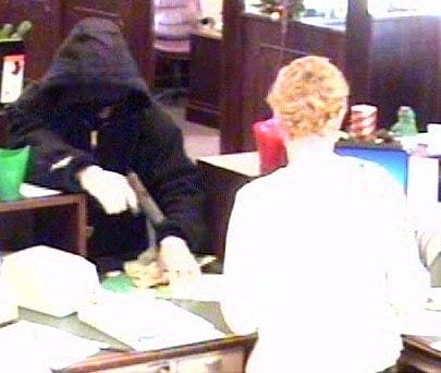 Millcreek Township police have released surveillance photos of one of two suspects involved in the robbery of the First National Bank on West Eighth Street on Jan. 6. CONTRIBUTED/