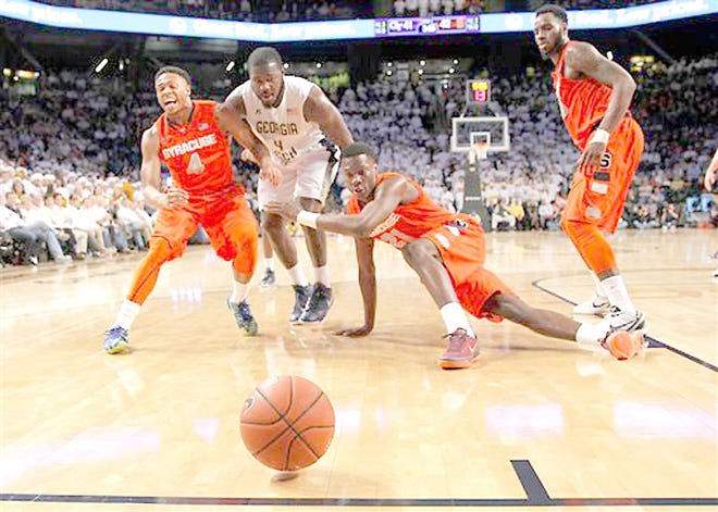 Syracuse guard Ron Patterson, Georgia Tech center Demarco Cox and Syracuse forward Tyler Roberson (from left) fight for the ball as it rolls out of bounds in the second half Wednesday. 



AP Photo/Todd Kirkland