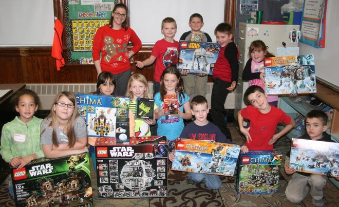 Ms Nasberg (back, left), a third grade teacher at School Street School, recently won over $1,000 worth of Lego products, and is as thrilled as her students. From left, in front, are Arianna, Allyanna, Alisha, Emily, Siearra, Noah, Cody and Robert. Standing behind are Gavyn, Landon, Brody and Lacy.