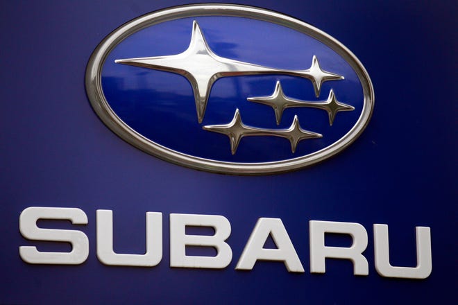 FILE - In this Aug. 31, 2011, file photo, a Subaru logo appears on a sign at a dealer's lot, in Portland, Ore. Subaru is recalling about 199,000 cars and SUVs for a second time to fix rusty brake lines that can leak fluid and cause longer stopping distances, according to reports, Thursday, Jan. 8, 2015. (AP Photo/Rick Bowmer, File)