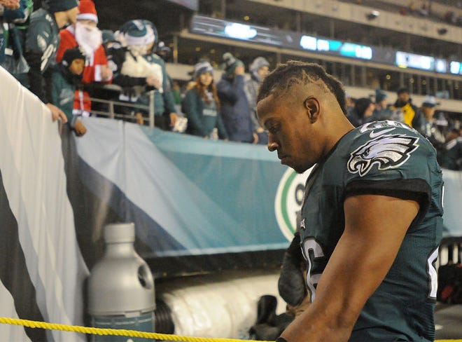 Eagles cornerback Cary Williams (26) walks off the field with his head down following the Eagles 38-27 loss to Dallas at Lincoln Financial Field on Sunday, December 14, 2014.